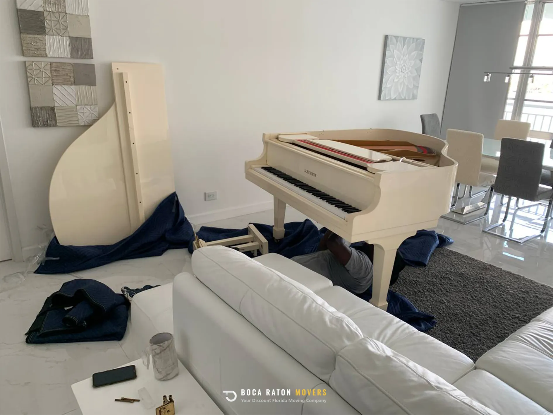 Boca Raton Movers Piano Moving Team Member Prepare Piano for Relocation