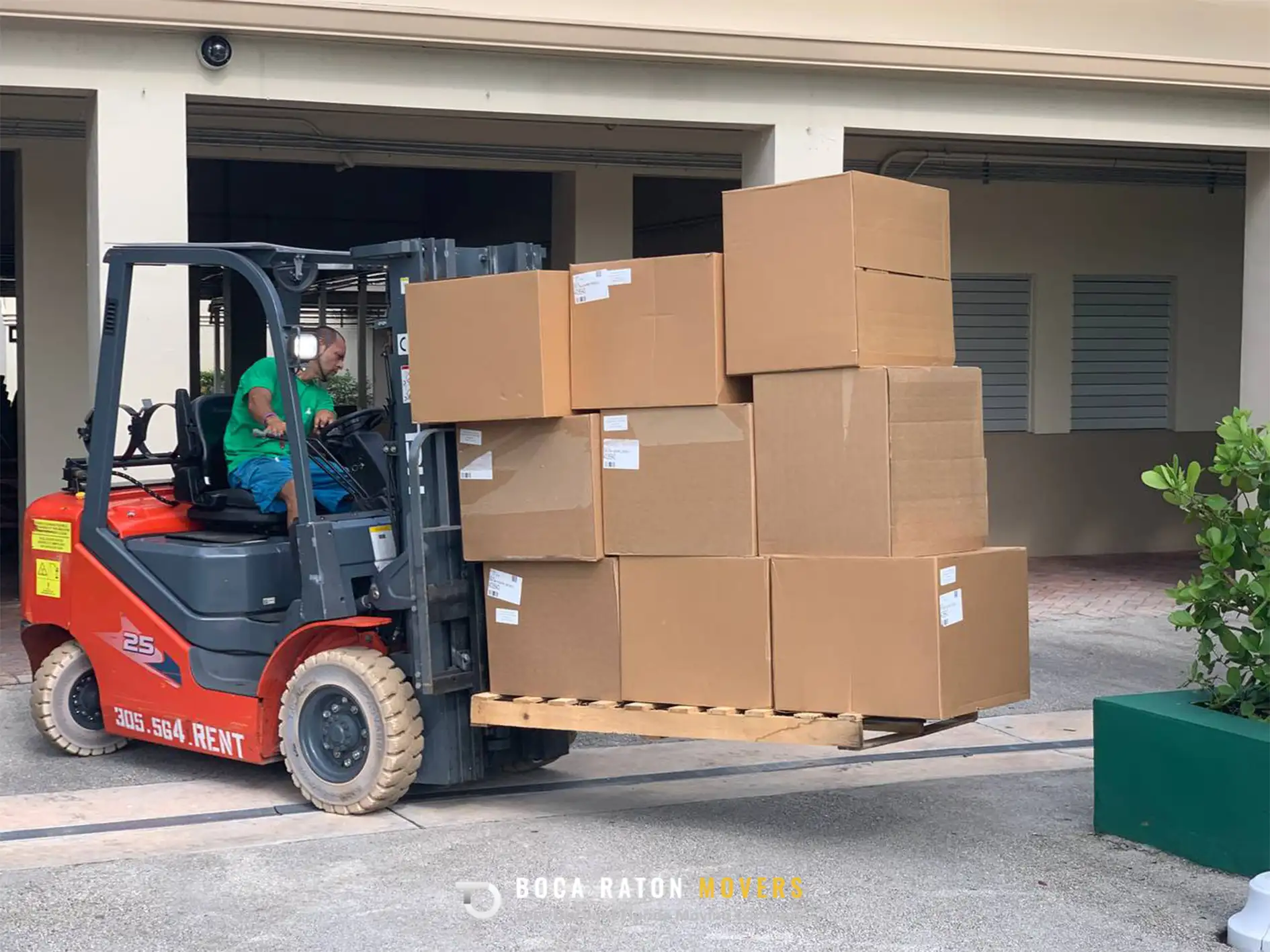 Boca Raton Movers Team Member on Loader Loading Boxes in Storage