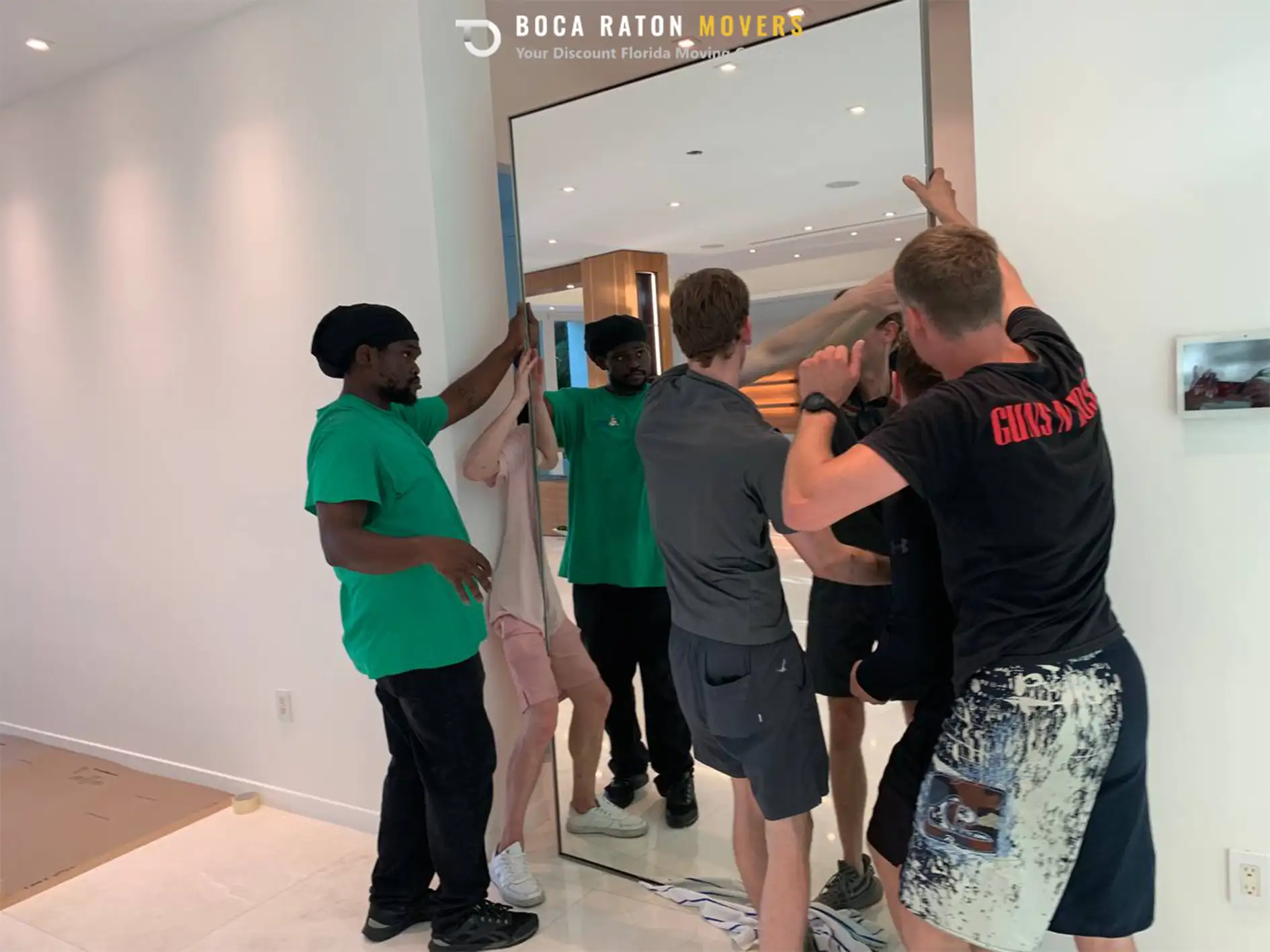 Boca Raton Movers Team Members Packing Mirror